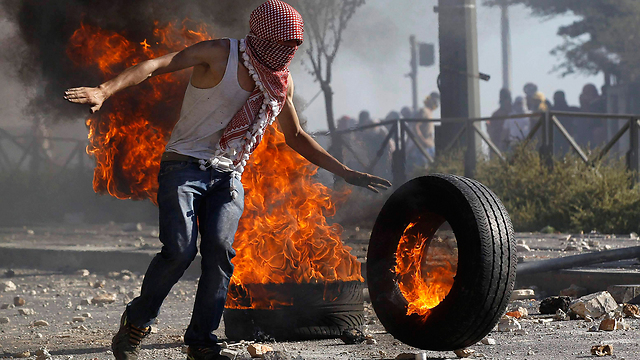 A Palestinian demonstrator this week (Photo: Reuters) (Photo: Reuters)