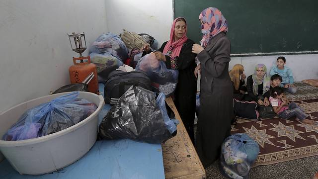 Palestinians taking shelter at UNRWA school (Photo: AP)