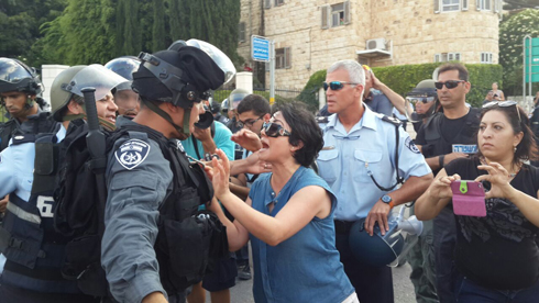 MK Zoabi faces off against riot police at a protest in Haifa. (Photo: Muhammed Shenawi) (Photo: Muhammed Shenawi)