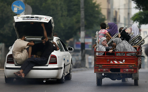 התושבים שהספיקו לברוח - למרות איומי חמאס (צילום: AFP) (צילום: AFP)