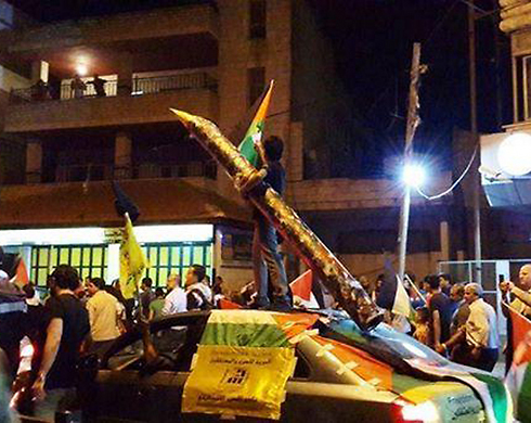 Model of Gaza rocket paraded in protest