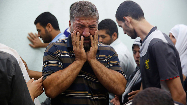 Gazans after attack on UNRA school in Jabalia. (Photo: Reuters)
