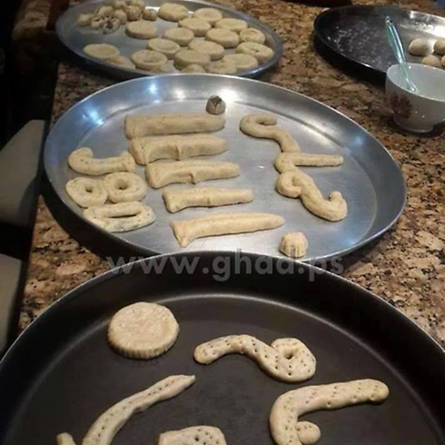 Cookies shaped as rockets and letters forming names of Gaza rockets