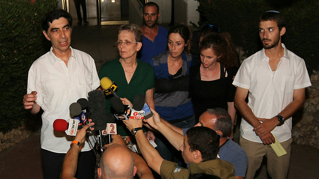 Hadar Goldin's family speaking to reporters (Photo: Ido Erez)