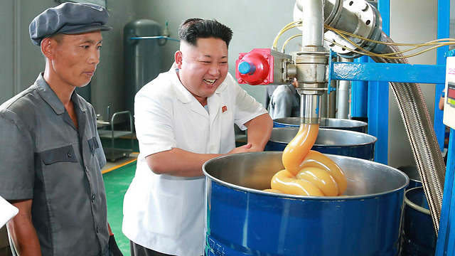 The N. Korean intersection of luxury and povery, embodied in one photo. Kim Jong-un visiting a local lubricant factory. (Photo: Reuters)