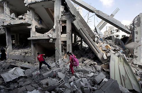 Palestinian children among the rubble after Operation Protective Edge (Photo: AFP) (Photo: AFP)