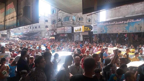 Crowds gather to watch the execution in Jabaliya.