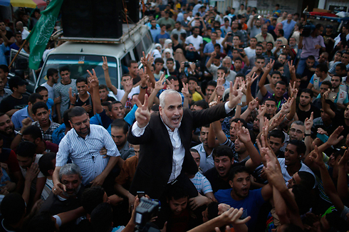 Hamas spokesman Fawzi Barhoum celebrates a Hamas 'victory' in Gaza (Photo: Reuters) (Photo: Reuters)