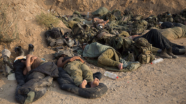 IDF troops resting on the Gaza border during Protective Edge (Photo: AFP) (Photo: AFP)