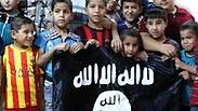 Children in Iraqi orphanage holding ISIS flag 