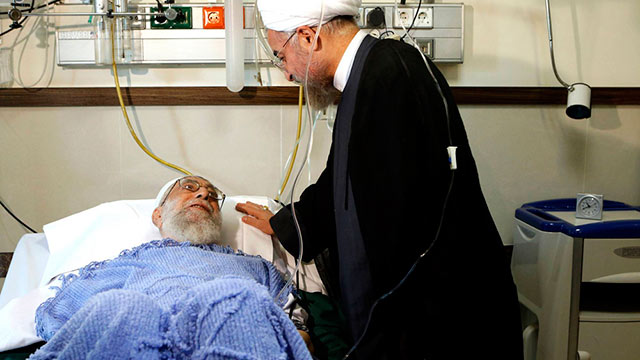 Current Iranian President Rouhani visiting Ayatollah Khamenei in the hospital (Photo: AP)