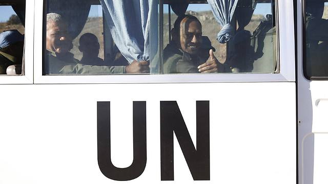 Fijian UN peacekeepers released by al-Qaeda-linked group gesture from inside a vehicle as they arrive in Golan Heights (Photo: Reuters) (Photo: Reuters)