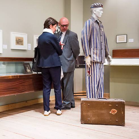 People look at part of the collection during the re-opening ceremony (Photo: AP) (Photo: EPA)