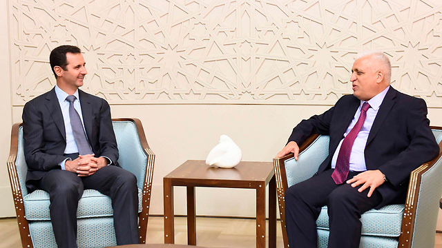 תמונה מהפגישה בין נשיא סוריה ליועץ העיראקי לביטחון לאומי (צילום: רויטרס) (צילום: רויטרס)