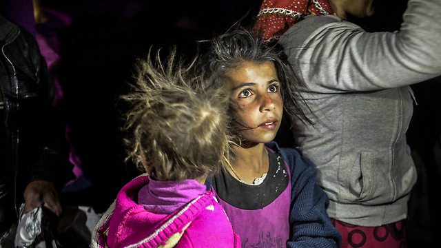 "עזבנו במהירות האפשרית". ילדה כורדית (צילום: AFP) (צילום: AFP)