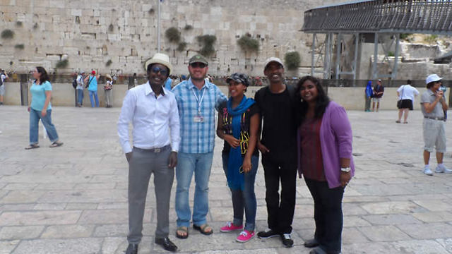 The Ethiopian doctoral students - Workey Tigabie, Naomi Teshome, and Hailemaryam Alemu - visit the Western Wall.