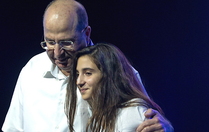 Defense Minister Moshe Ya'alon embraces one of the bat mitzvah celebrants (Photo: Ohad Zwigenberg) (Photo: Ohad Zwigenberg)