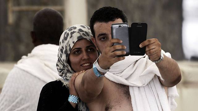 Muslim pilgrims snap a selfie during the 'Jamarat' ritual in Mina, near Mecca (Photo: AFP) (Photo: AFP)