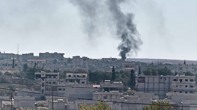 A billow of smoke over Kobani from fights between Kurdish and Islamic State fighters (Photo: AFP)