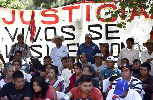המשפחות דורשות צדק (צילום: AFP) (צילום: AFP)