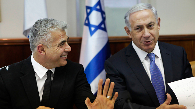 Happier days: Netanyahu told Lapid during the budget vote that he was free to leave the government (Photo: Reuters) (Photo: Reuters)
