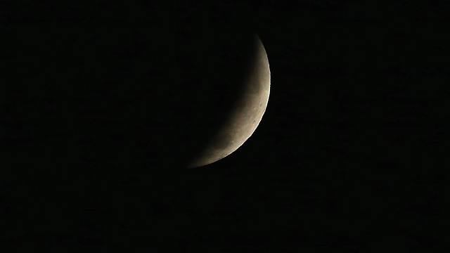 הירח כמעט נעלם בשמי וושינגטון (צילום: AFP) (צילום: AFP)