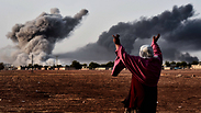 Kurdish woman watching US airstrikes on Kobani from afar (Photo: AFP) (Photo: AFP)