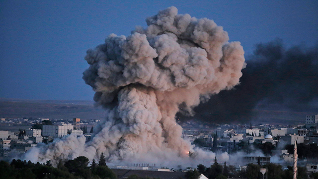 An explosion in the Syrian city of Kobani by the international coalition fighting the Islamic State. (Photo: Associated Press) (Photo: Associated Press)
