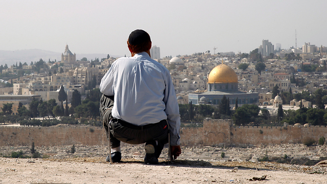 Glick overlooking Temple Mount. 'It never occurred to me that he was putting himself in danger before anyone else' (Photo: Atta Awisat)  