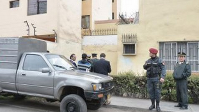 Peru security forces outside Muhammad Amadar's apartment.