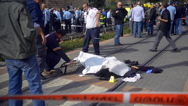 Al-Akari's body at the scene. (Photo: AP)