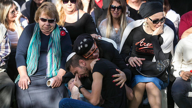 Almog's family at the funeral (Photo: Reuters)