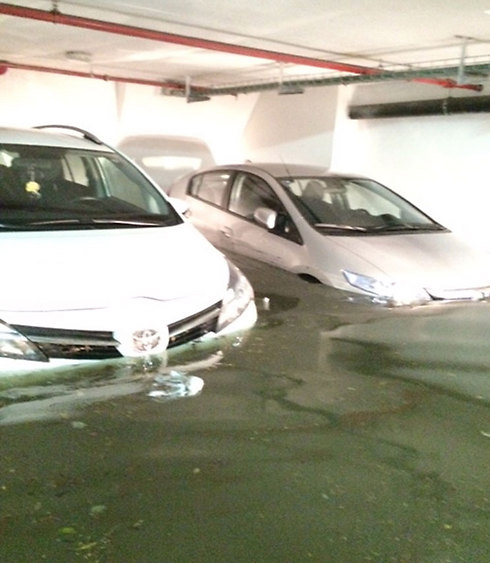 Flooding in a parking lot in Ramat Gan. (Photo: Royi Basseches) (Photo: Royi Basseches)