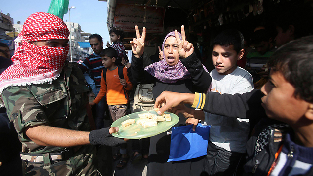Sweets handed out in Gaza to celebrate the attack (Photo: Reuters)