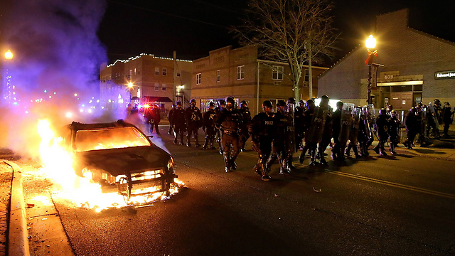 Police cruiser burns (Photo: AFP)