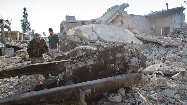 Kurdish forces in Kobani after fighting against Islamic State fighters (Photo: AP) (Photo: AP)