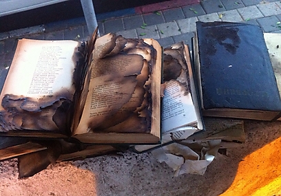 Torched books found outside synagogue