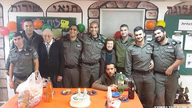 Border policemen celebrate Holocaust survivor's birthday. (Photo: Israel Police Spokesman's Unit) (Photo: Israel Police Spokesman's Unit)