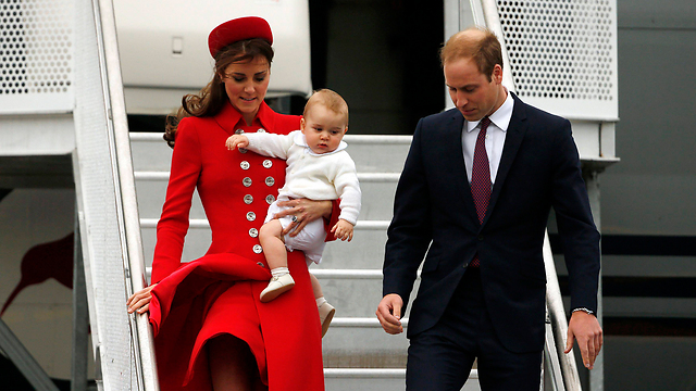 Prince William with his wife Kate and firstborn son Prince George during a trip to New Zealand a year ago (Photo: Reuters)