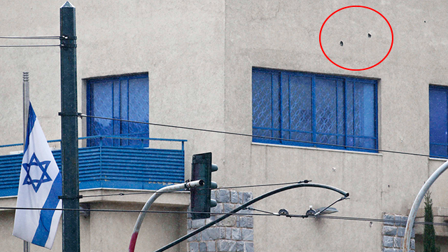 Bullet-holes in Israeli embassy in Athens (Photo: Reuters)