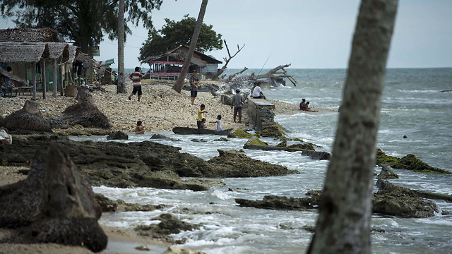 שעות הפנאי באזור החוף המשוקם (צילום: AFP) (צילום: AFP)