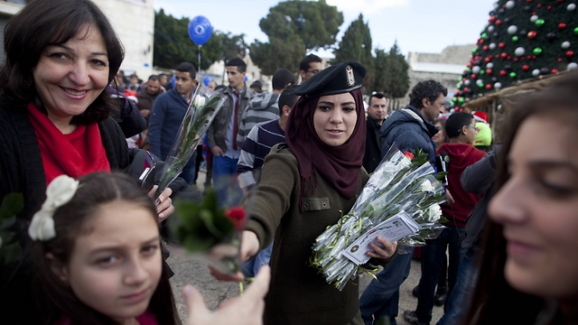 Flowers passed out at Christmas celebrations in Bethlehem. (Photo: Getty Images) (Photo: Getty Images)