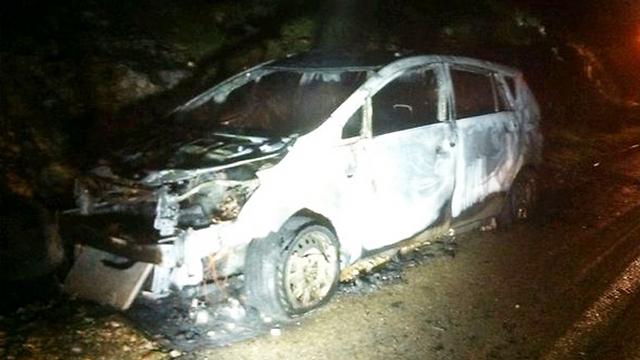 The car damaged in the attack. (Photo: Judea and Samaria District Fire Department)