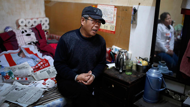 וו שינגפו. בנו בן השנה נחטף בעודו ישן במיטתו  (צילום: AP) (צילום: AP)