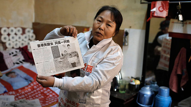 ז'אנג שיוהונג. בתה בת ה-15 נחטפה בדרכה לבית ספר לפני שש שנים (צילום: AP) (צילום: AP)