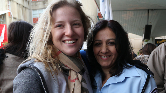 All grown up: Shani at the IDF induction center with policewoman Ziona (Photo: Shaul Golan)