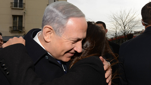 Netanyahu embraces a survivor of the Paris terror attack. (Photo: Haim Zach/GPO) (Photo: Haim Zach / GPO)