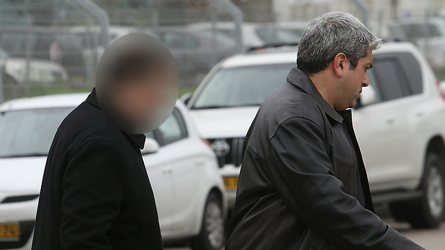 Land Authority official leaves police offices (Photo: Ido Erez)