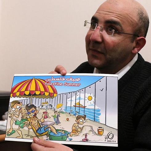 Ramzy Taweel shows one of his drawing in the West Bank city of Ramallah (Photo: AFP) (Photo: AFP)