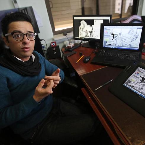 Mohammad Sabaaneh, who works for newspaper al-Hayat al-Jadida, speaks at his office in Ramallah (Photo: AFP) (Photo: AFP)